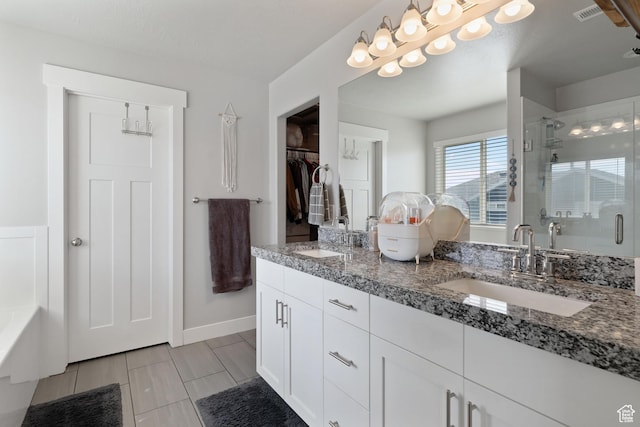 7016 N Amber Mead Ave, Eagle Mountain, UT 84005 - full bath with double vanity, a sink, a stall shower, and visible vents