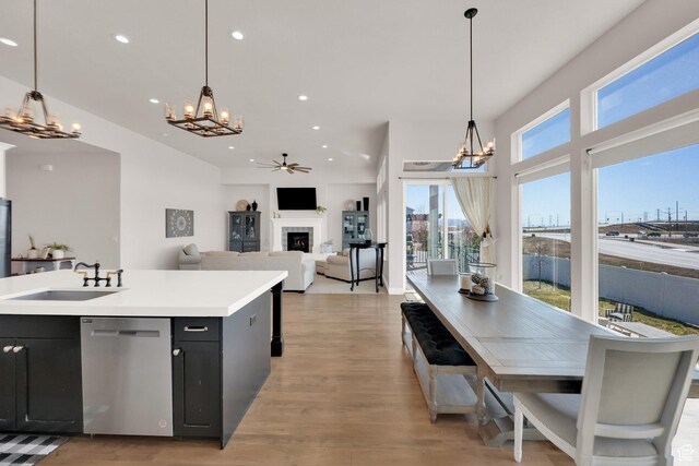 2266 S Betsys Way, Kaysville, UT 84037 - kitchen featuring stainless steel dishwasher, a chandelier, a sink, dark cabinetry, and recessed lighting