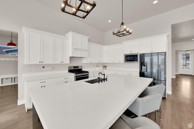 2266 S Betsys Way, Kaysville, UT 84037 - kitchen featuring stainless steel appliances, a sink, a chandelier, white cabinetry, and recessed lighting
