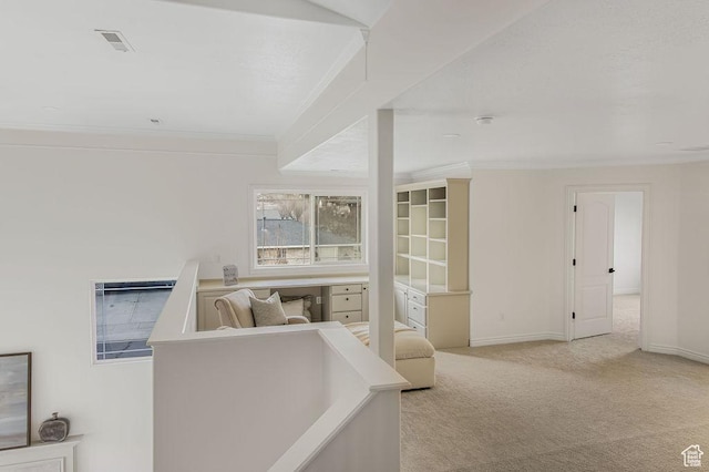 interior space featuring ornamental molding, visible vents, carpet, and baseboards