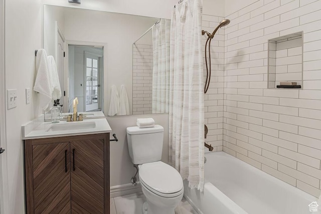 bathroom with shower / bath combo with shower curtain, toilet, and vanity
