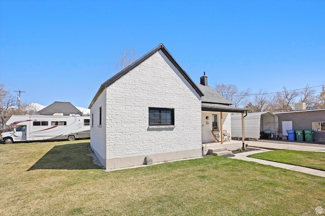 exterior space featuring a front lawn, a chimney, cooling unit, and covered porch