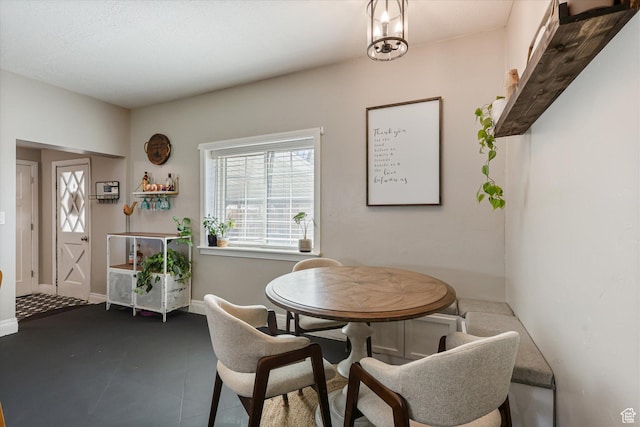 dining area featuring baseboards