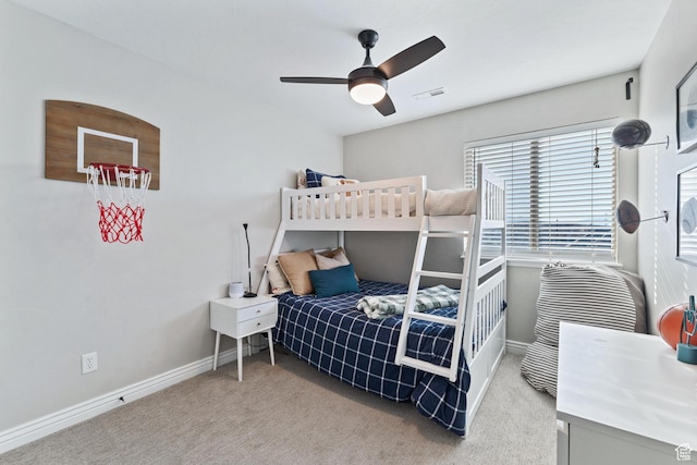 bedroom featuring baseboards, visible vents, ceiling fan, and carpet flooring