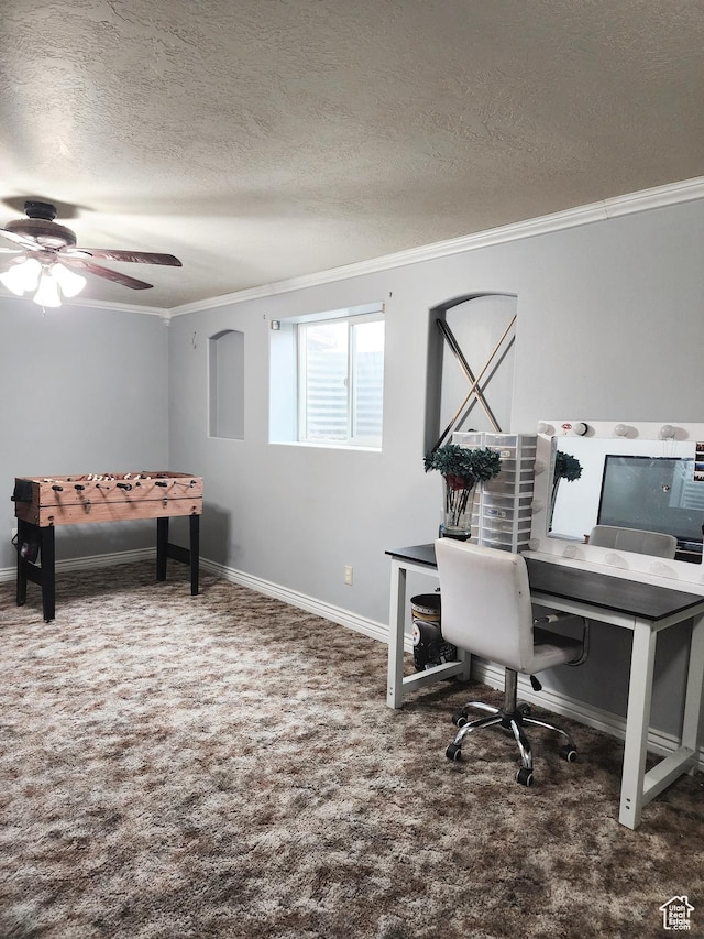 carpeted home office with baseboards, crown molding, ceiling fan, and a textured ceiling