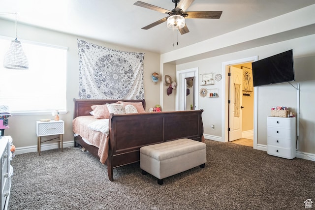 bedroom featuring baseboards, carpet floors, and a ceiling fan