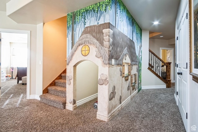 staircase featuring baseboards, recessed lighting, and carpet