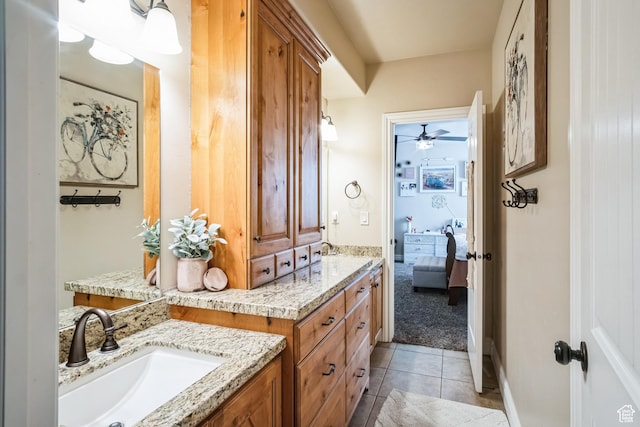 ensuite bathroom with ensuite bath, a ceiling fan, tile patterned floors, and vanity