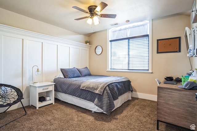 carpeted bedroom with baseboards, ceiling fan, and visible vents