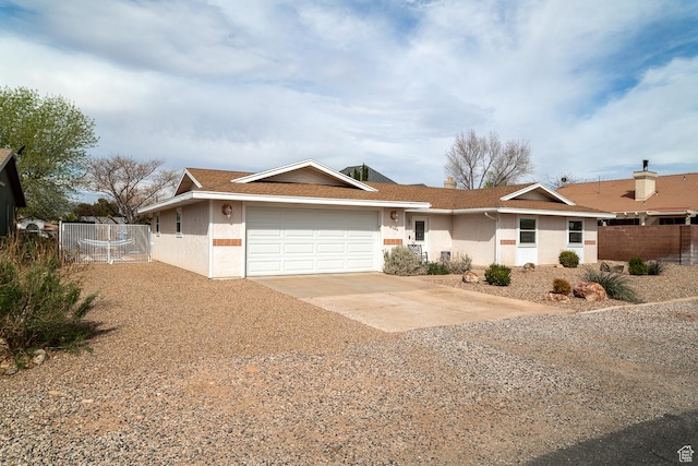 2164 S Alison Row, St George, UT 84790 - ranch-style house with dirt driveway, an attached garage, fence, and stucco siding