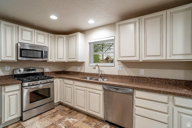 2164 S Alison Row, St George, UT 84790 - kitchen featuring a textured ceiling, a sink, recessed lighting, and appliances with stainless steel finishes