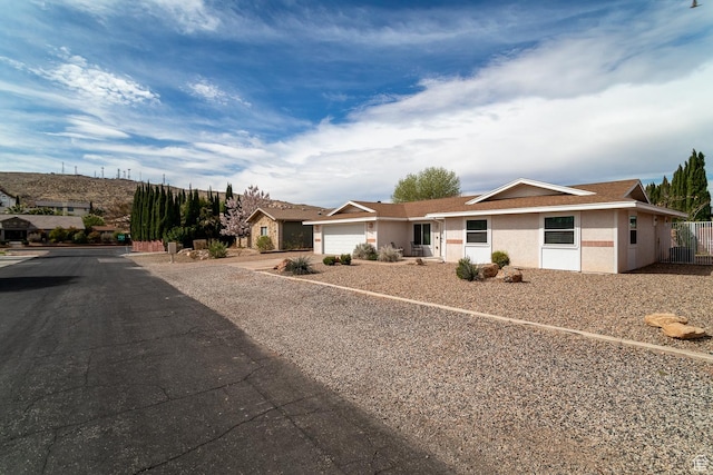 2164 S Alison Row, St George, UT 84790 - ranch-style house with fence, stucco siding, a garage, and concrete driveway