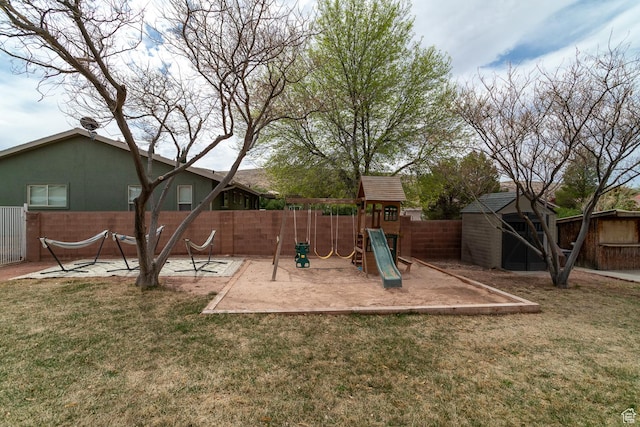 2164 S Alison Row, St George, UT 84790 - view of yard featuring an outbuilding, fence, and a playground