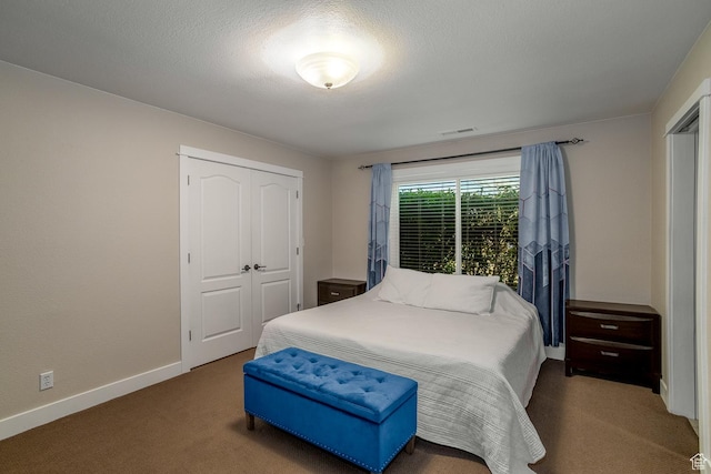 2164 S Alison Row, St George, UT 84790 - carpeted bedroom featuring a closet, a textured ceiling, baseboards, and visible vents