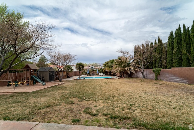 2164 S Alison Row, St George, UT 84790 - view of yard featuring a fenced in pool, a fenced backyard, and a playground