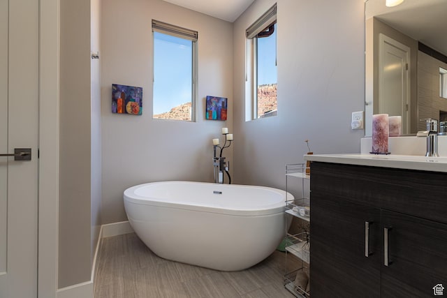484 E Mohawk Dr, Kanab, UT 84741 - full bath featuring baseboards, a freestanding tub, and vanity