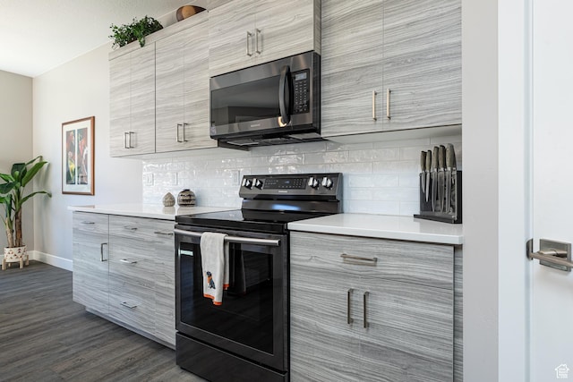 484 E Mohawk Dr, Kanab, UT 84741 - kitchen featuring stainless steel microwave, modern cabinets, electric range, and decorative backsplash