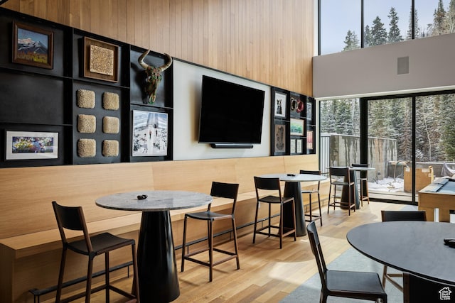 3267 W Deer Hollow Rd Unit 2402, Park City, UT 84060 - dining area featuring wood finished floors and a towering ceiling