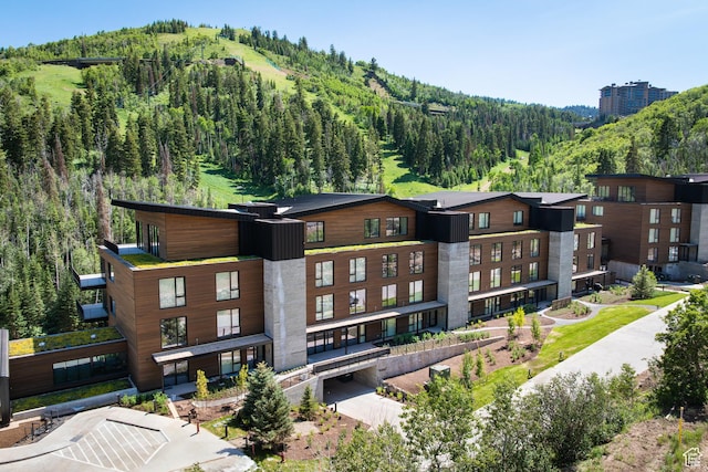 3267 W Deer Hollow Rd Unit 2402, Park City, UT 84060 - view of building exterior featuring a forest view and a mountain view