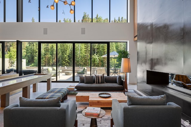 3267 W Deer Hollow Rd Unit 2402, Park City, UT 84060 - living area with a towering ceiling and healthy amount of natural light
