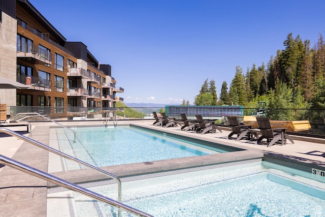 3267 W Deer Hollow Rd Unit 2402, Park City, UT 84060 - community pool featuring a patio