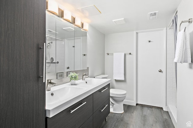 851 E Three Fountains Dr Unit 240, Murray, UT 84107 - full bath with a sink, a shower, wood finished floors, and visible vents