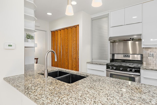 851 E Three Fountains Dr Unit 240, Murray, UT 84107 - kitchen with wall chimney range hood, open shelves, a sink, stainless steel gas stove, and decorative backsplash