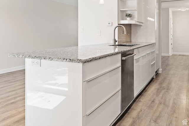 851 E Three Fountains Dr Unit 240, Murray, UT 84107 - kitchen with white cabinets, open shelves, a sink, decorative backsplash, and modern cabinets