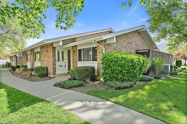 851 E Three Fountains Dr Unit 240, Murray, UT 84107 - view of front of property featuring brick siding and a front lawn