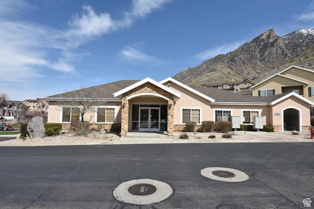 1138 S Meadow Fork Rd E Unit 3, Provo, UT 84606 - view of front of house featuring stone siding, stucco siding, a mountain view, and french doors