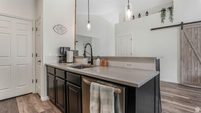 1138 S Meadow Fork Rd E Unit 3, Provo, UT 84606 - kitchen with dishwasher, a sink, light wood-style floors, a barn door, and hanging light fixtures