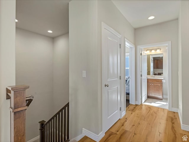 11126 S Kiwano Way S, Jordan, UT 84009 - corridor featuring baseboards, light wood-type flooring, an upstairs landing, and recessed lighting