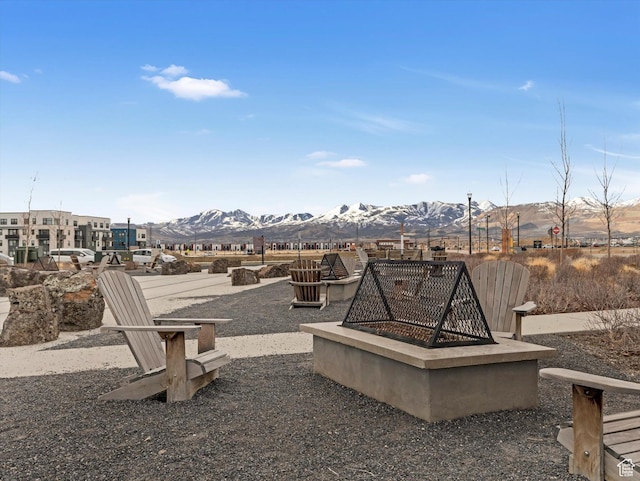 11126 S Kiwano Way S, Jordan, UT 84009 - view of patio featuring a fire pit and a mountain view