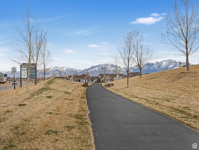 11126 S Kiwano Way S, Jordan, UT 84009 - view of street featuring a mountain view and traffic signs