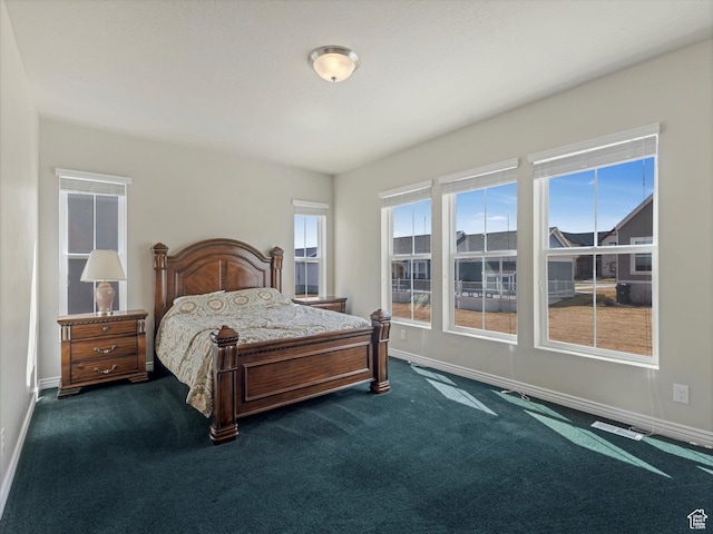 11126 S Kiwano Way S, Jordan, UT 84009 - bedroom featuring baseboards and dark carpet
