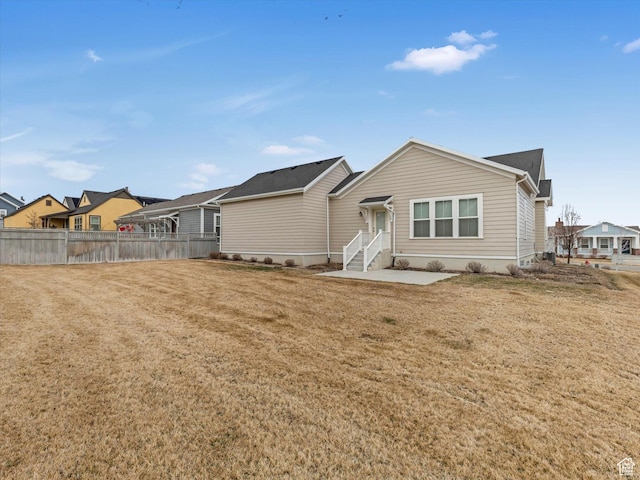 11126 S Kiwano Way S, Jordan, UT 84009 - back of property featuring a residential view, a yard, and fence