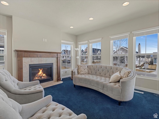 11126 S Kiwano Way S, Jordan, UT 84009 - carpeted living area featuring baseboards, a fireplace, and recessed lighting
