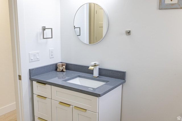 bathroom featuring vanity and baseboards