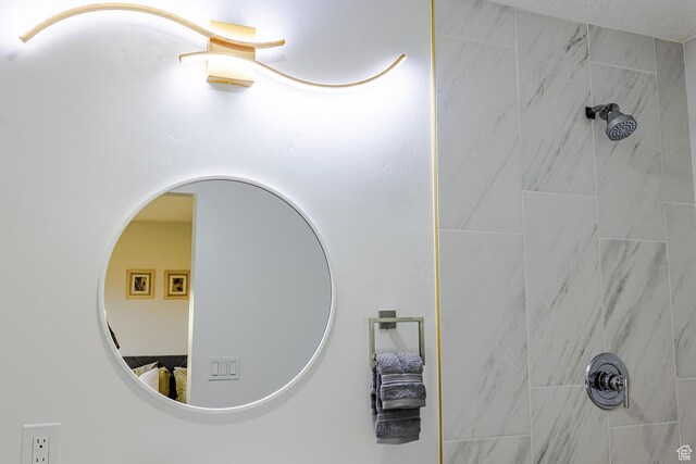 details with a tile shower and arched walkways