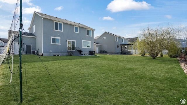 442 Doubleday St, Mapleton, UT 84664 - rear view of house featuring a lawn and cooling unit