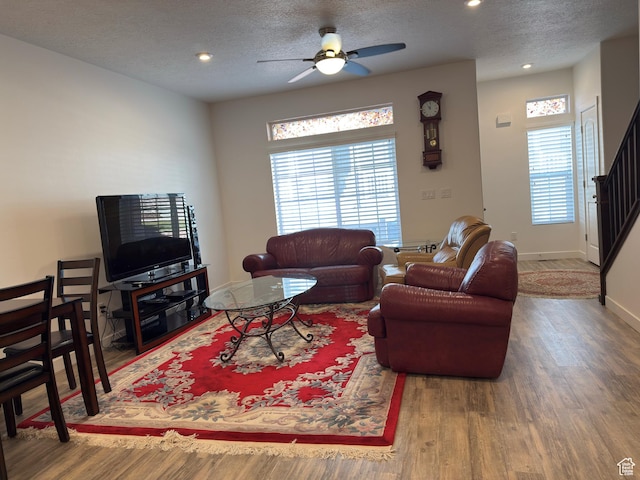 5264 S Tucker Ct W Unit 329, West Valley City, UT 84118 - living area featuring wood finished floors, a textured ceiling, a healthy amount of sunlight, and ceiling fan