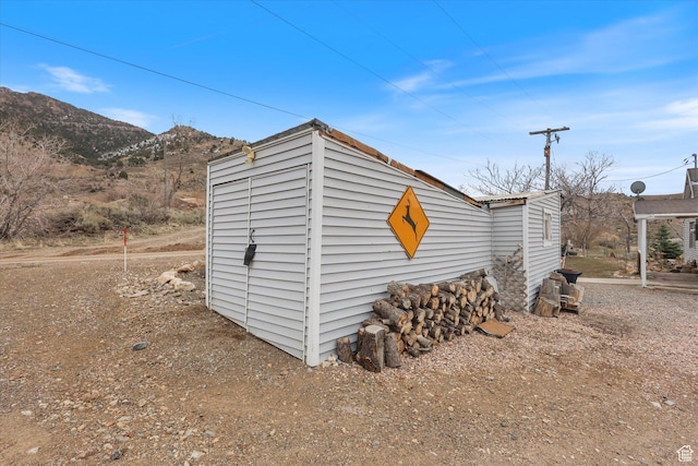 view of outbuilding featuring a mountain view
