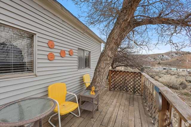 wooden terrace featuring a mountain view