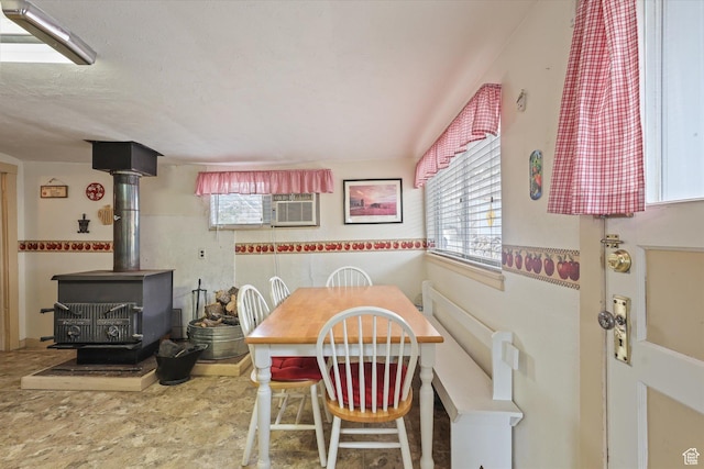 dining space with a wood stove