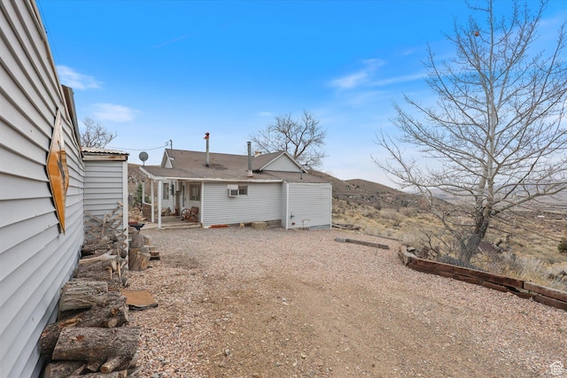 view of yard with dirt driveway