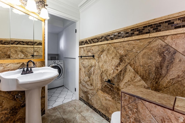 945 Church St, Layton, UT 84041 - bathroom with tile walls, crown molding, tile patterned flooring, and washer / dryer