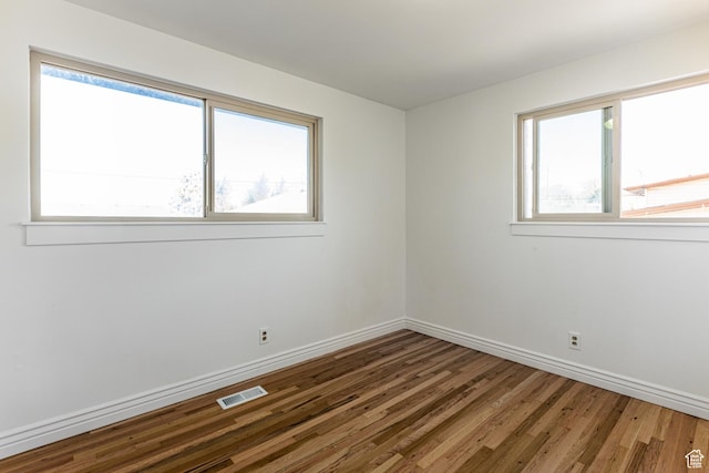 945 Church St, Layton, UT 84041 - spare room featuring visible vents, baseboards, and wood finished floors