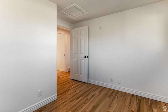 945 Church St, Layton, UT 84041 - unfurnished room with attic access, baseboards, and wood finished floors