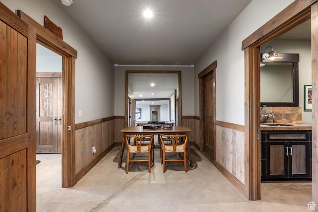 5956 N Triple Crown Trl, Oakley, UT 84055 - dining space featuring a wainscoted wall, wood walls, and recessed lighting