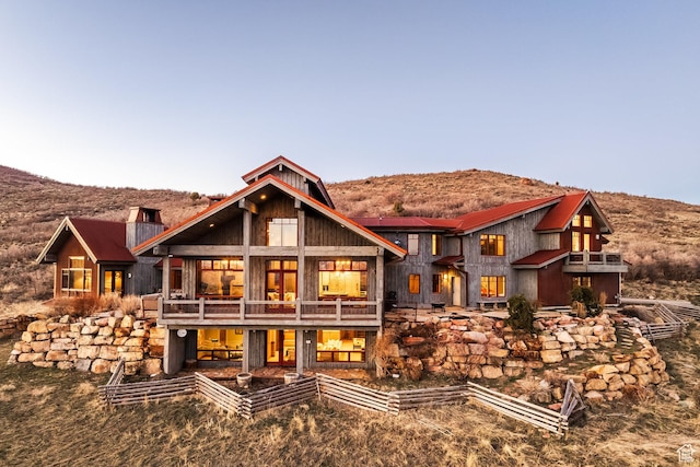 5956 N Triple Crown Trl, Oakley, UT 84055 - rear view of property with a balcony, a chimney, and a mountain view